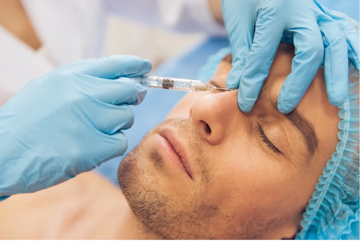 An injection into the frown lines between the eyebrows